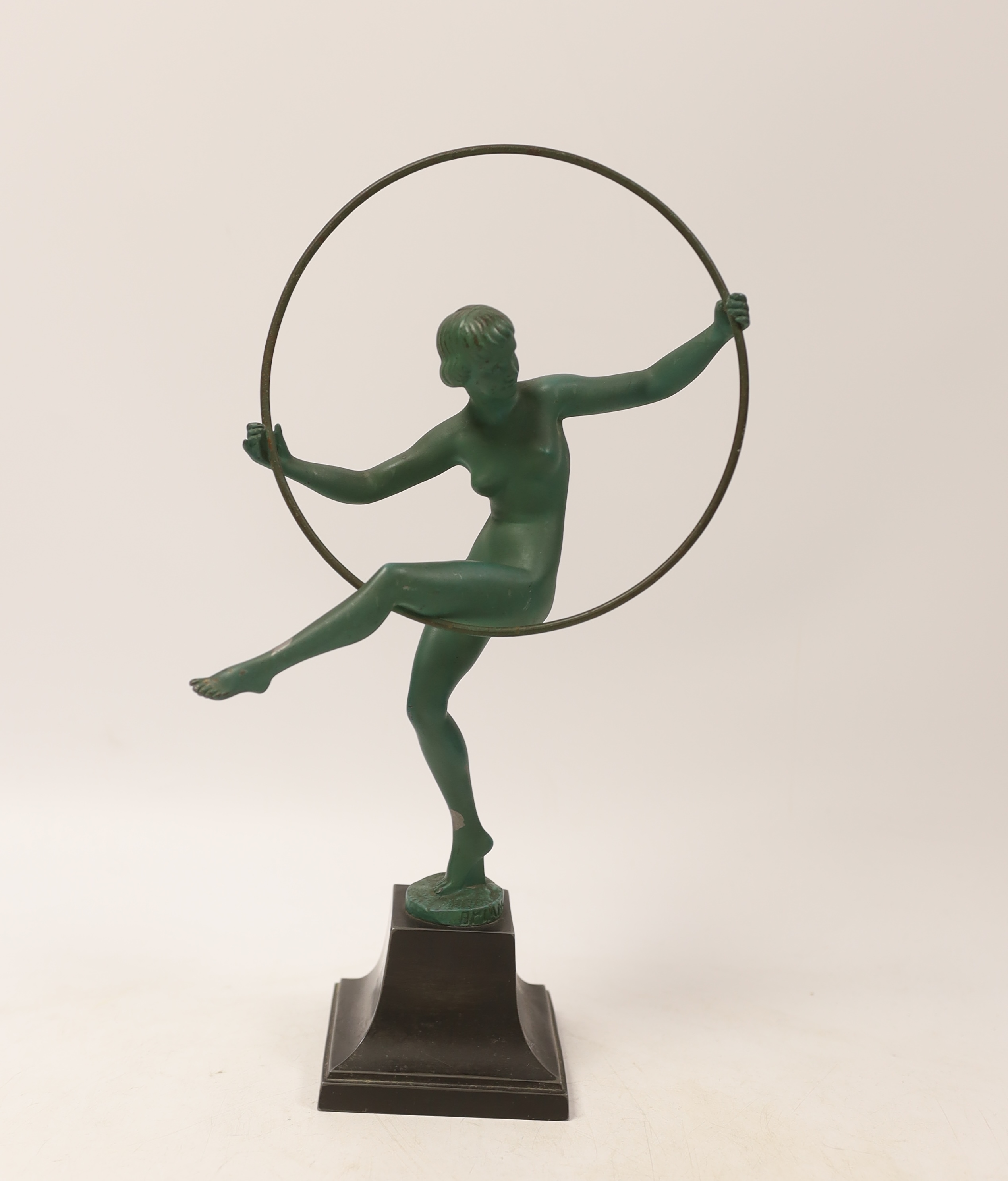 An Art Deco spelter model of a hoop dancer, signed Briand, 29cm. Condition - fair to good